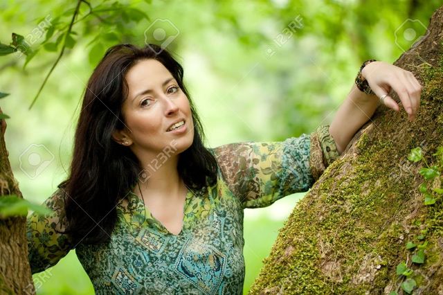 beautiful mature mature woman photo beautiful park posing near stock tree verdant smithore trunk