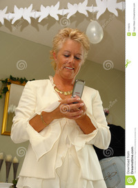 mature photos mature lady party sending sms stock photo